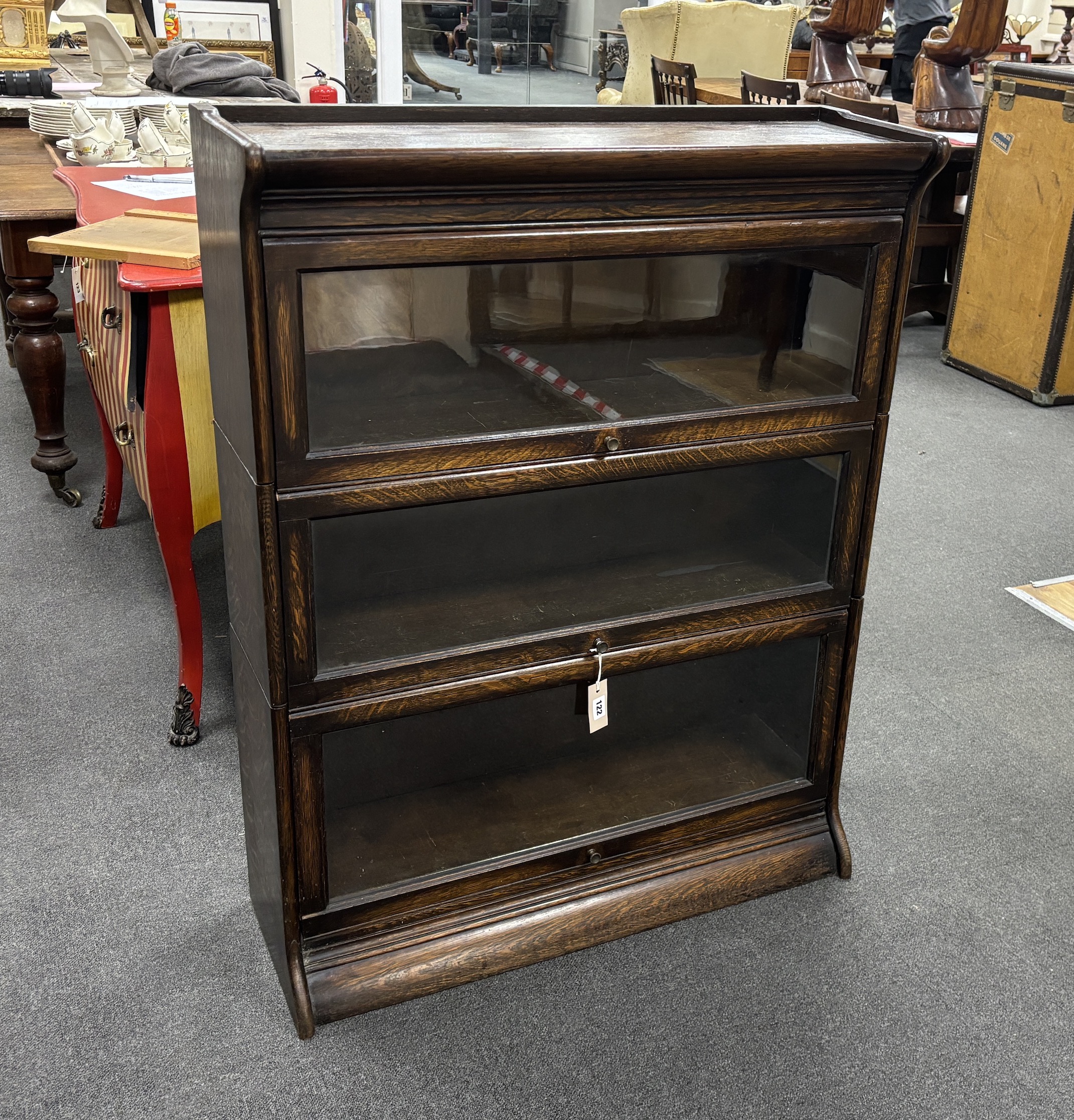 An oak Globe Wernicke style three section bookcase, width 87cm, depth 30cm, height 113cm